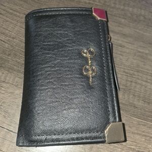 Elegant Black Wallet with Gold and Pink Details